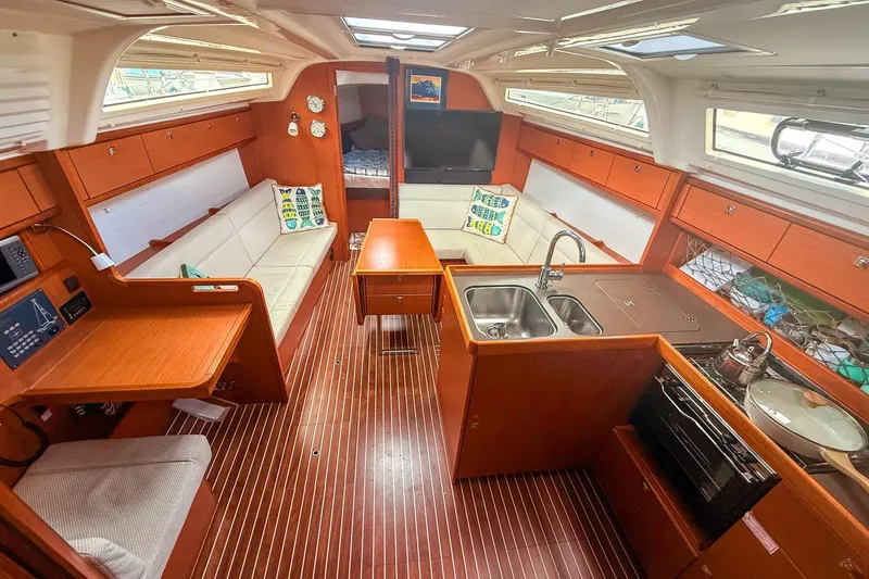 Slide: The Image of Interior of 2014 Bavaria Cruiser 37 yacht with modern kitchen and seating area. - 4