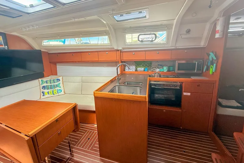 Slide: The Image of Interior of 2014 Bavaria Cruiser 37 yacht with modern kitchen and cozy seating area. - 10