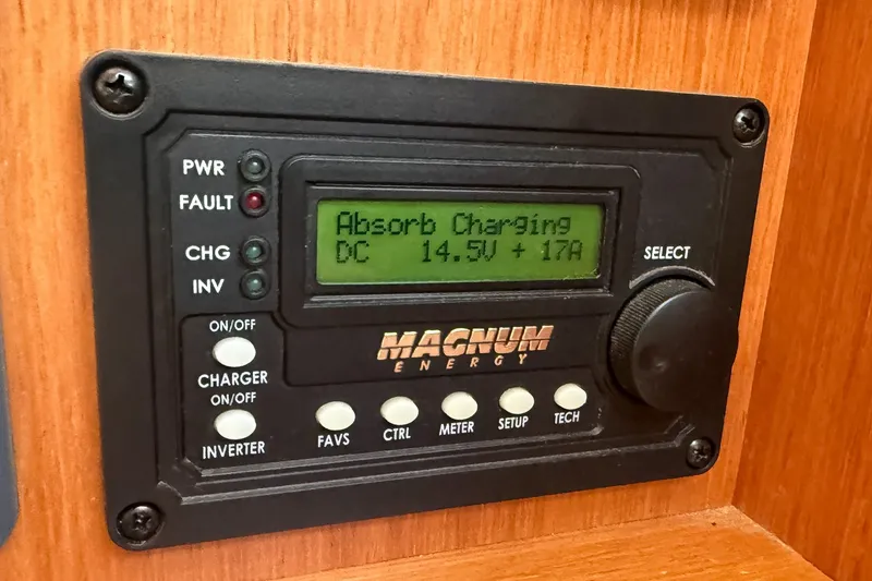 Slide: The Image of Magnum Energy control panel displaying absorb charging status on Bavaria Cruiser 37, 2014 model. - 50