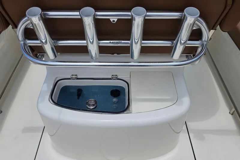 Slide: The Image of 2026 Pioneer 222 Sportfish boat with rod holders and livewell, featuring sleek design. - 15