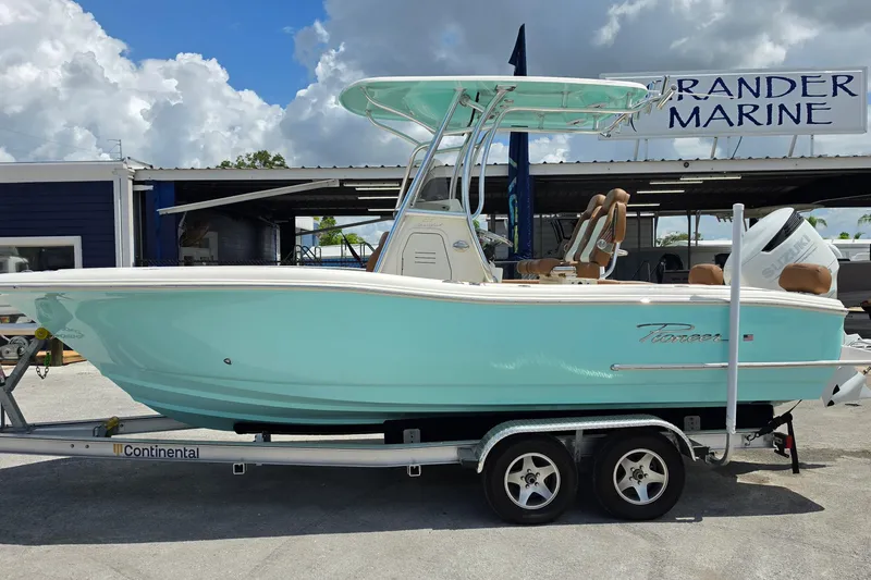 Slide: The Image of 2026 Pioneer 222 Sportfish boat on trailer at Grander Marine dealership. - 2