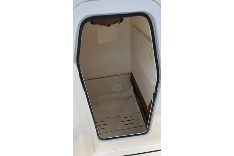Slide: The Image of Interior view of 2026 Pioneer 222 Sportfish storage compartment. - 16