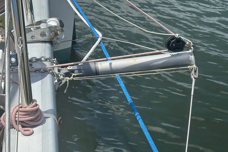 Slide: The Image of Close-up of a 2010 Lagoon 440 sailboat rigging and pulleys over water. - 25