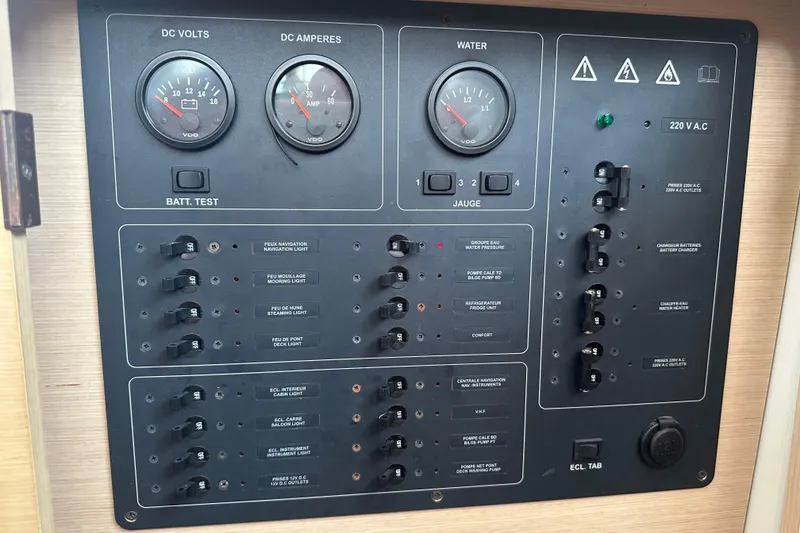 Slide: The Image of Electrical control panel of a 2010 Lagoon 440 catamaran with gauges and switches. - 28