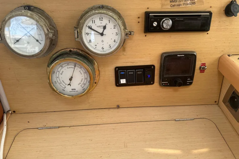 Slide: The Image of Control panel of a 2010 Lagoon 440 yacht with gauges and navigation equipment. - 26