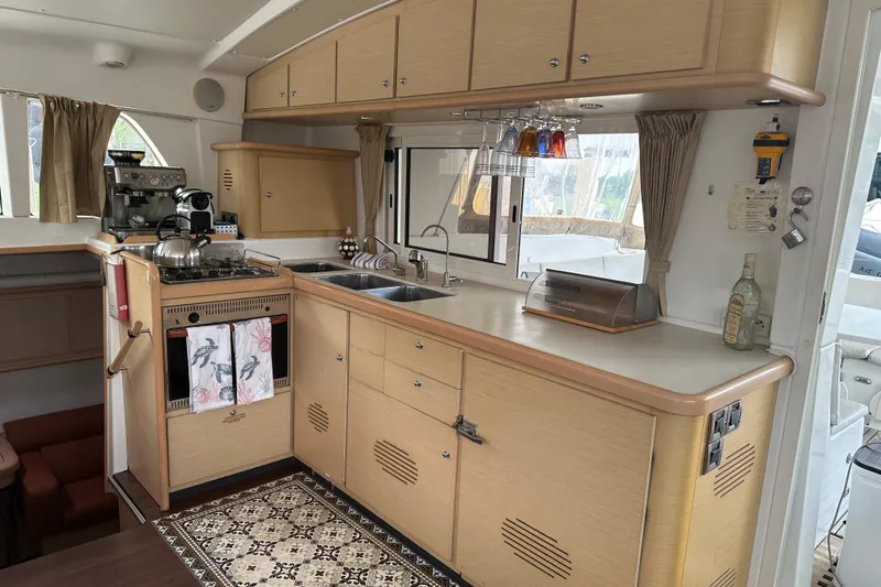 The Image of Spacious kitchen in 2010 Lagoon 440 yacht with modern appliances and ample storage. - 0