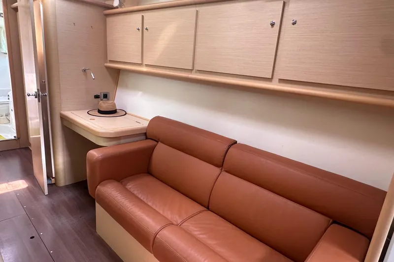 Slide: The Image of Luxurious interior of 2010 Lagoon 440 yacht with leather sofa and wooden cabinetry. - 50