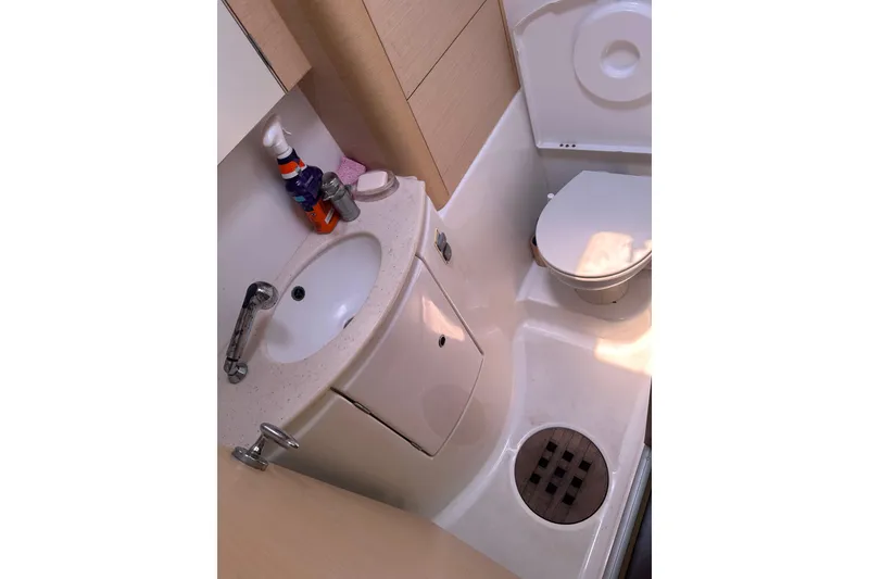 Slide: The Image of Compact bathroom in a 2010 Lagoon 440 yacht with sink and toilet. - 31