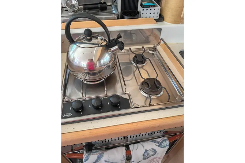 Slide: The Image of Stainless steel stove with kettle on Lagoon 440, 2010 model yacht kitchen. - 33