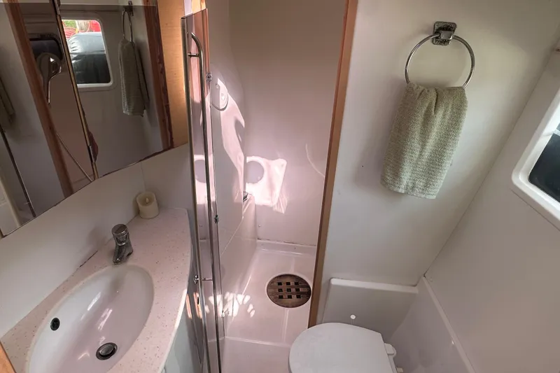 Slide: The Image of Bathroom interior of 2010 Lagoon 440 yacht with sink, shower, and towel. - 55