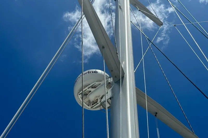 Slide: The Image of Close-up of a mast with radar on a 2010 Lagoon 440 against a blue sky. - 24