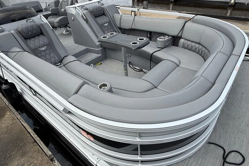 Slide: The Image of 2023 Bennington 25RTSB pontoon boat with luxurious gray seating and cup holders. - 3