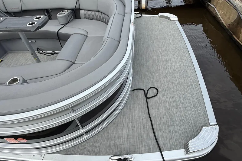 Slide: The Image of 2023 Bennington 25RTSB pontoon boat with sleek seating and modern design. - 5