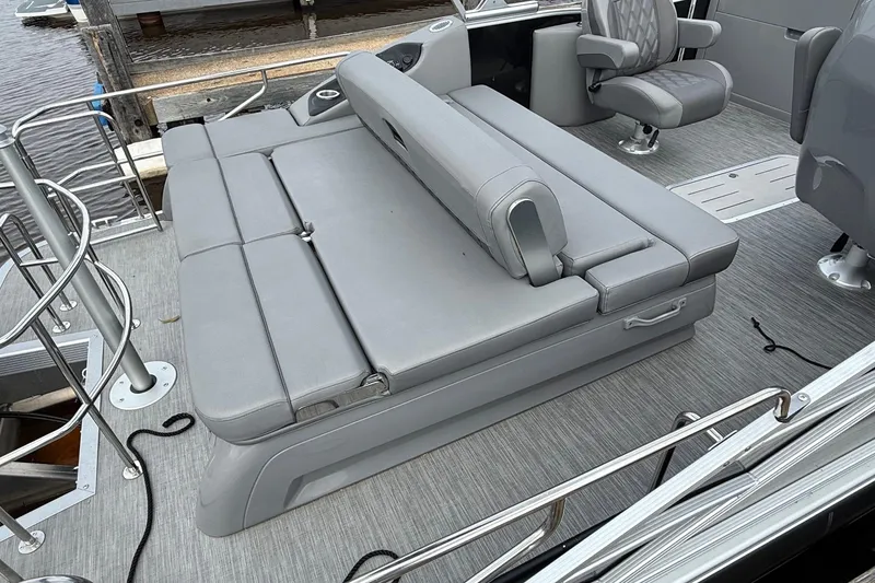Slide: The Image of 2023 Bennington 25RTSB boat interior with gray seating and modern design. - 7