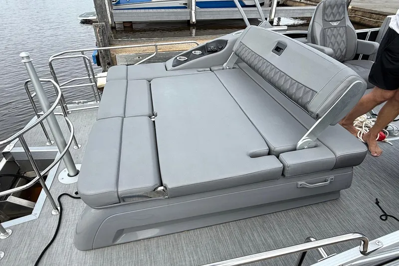 Slide: The Image of 2023 Bennington 25RTSB boat with luxurious gray seating and adjustable backrest. - 9