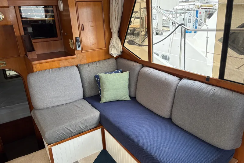 Slide: The Image of Interior of 1986 CHB Ponderosa yacht with cozy seating and wooden accents. - 27