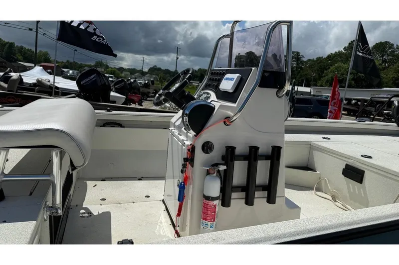Slide: The Image of 2022 Ranger RB200 boat interior with console, steering wheel, and rod holders. - 6