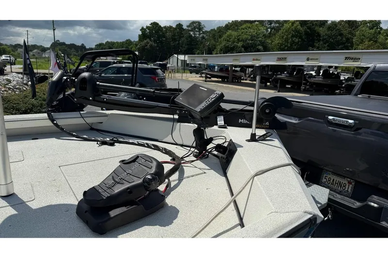 Slide: The Image of 2022 Ranger RB200 boat with trolling motor and electronics in a dealership lot. - 7