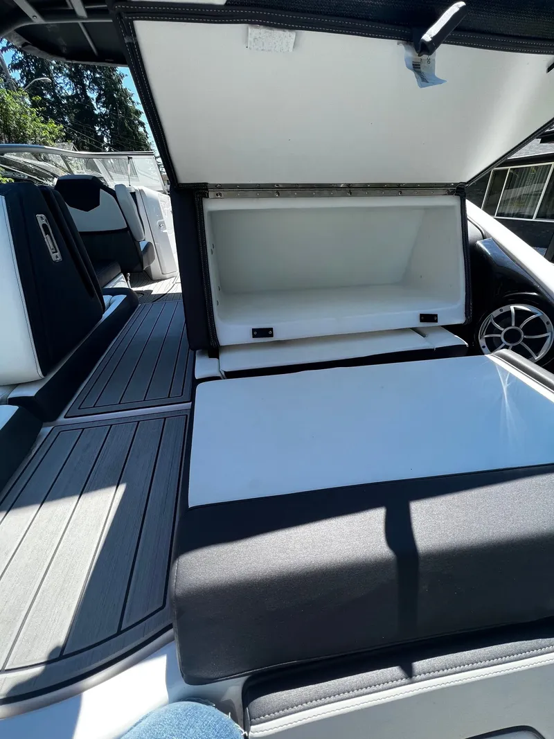 Slide: The Image of The image shows the interior of a Yamaha 252SE boat with open storage compartments. - 6