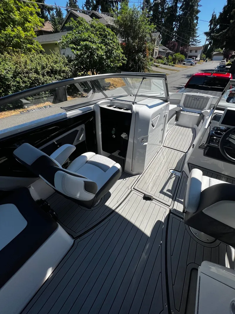 Slide: The Image of The image shows the cockpit of a 2022 Yamaha 252SE boat with modern seating and controls. - 9