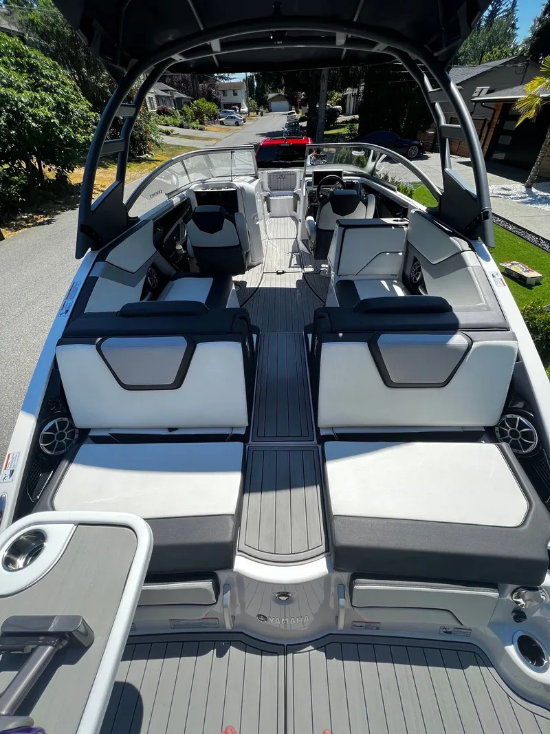 Slide: The Image of The image shows the interior of a 2022 Yamaha 252SE boat with modern seating. - 3