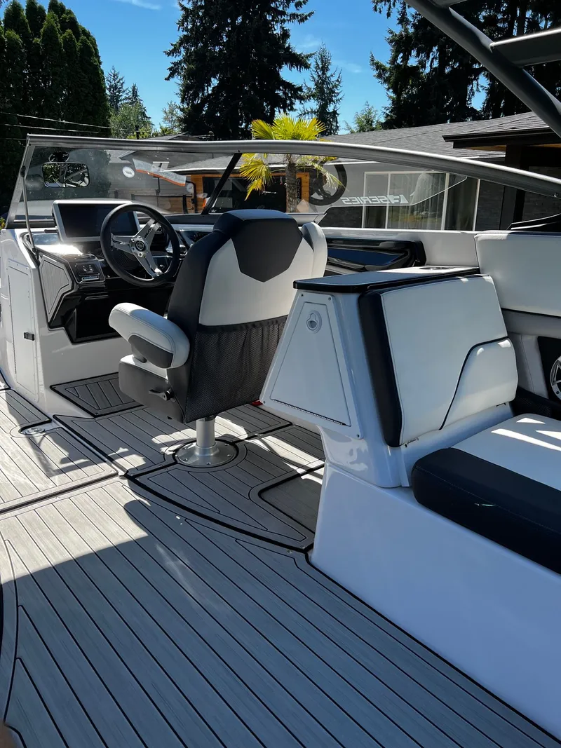 Slide: The Image of The image shows the cockpit of a 2022 Yamaha 252SE boat with modern seating and controls. - 11