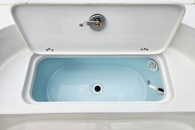 Slide: The Image of Livewell compartment on 2023 Key West 188 Bay Reef boat, open lid view. - 21