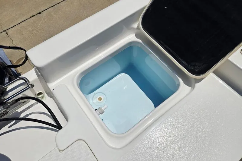 Slide: The Image of Open storage compartment on 2023 Key West 188 Bay Reef boat, showing interior details. - 45