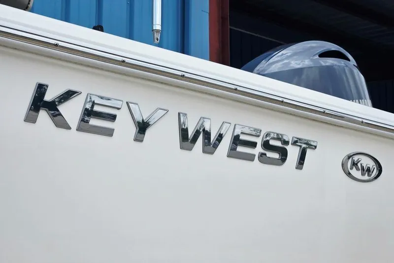 Slide: The Image of 2023 Key West 188 Bay Reef boat with chrome logo and KW emblem. - 9