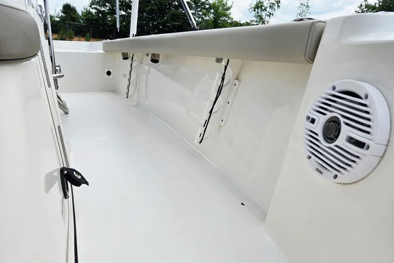 Slide: The Image of 2023 Key West 188 Bay Reef boat interior with speaker and clean white deck. - 28