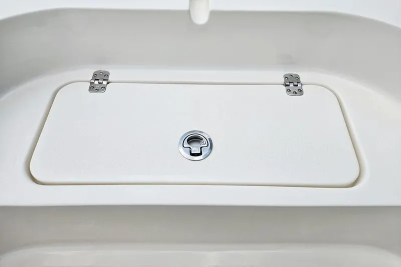 Slide: The Image of 2023 Key West 188 Bay Reef boat storage compartment with secure latch and hinges. - 22
