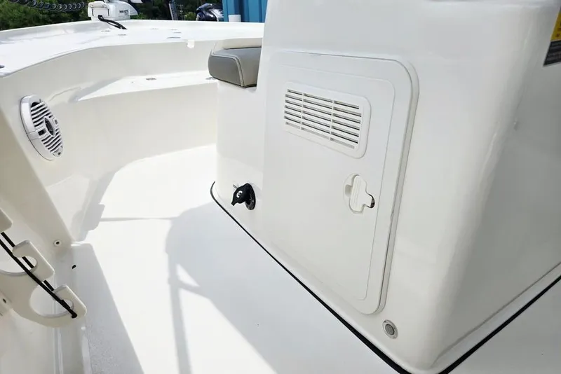 Slide: The Image of 2023 Key West 188 Bay Reef boat interior with storage compartment and seating. - 30