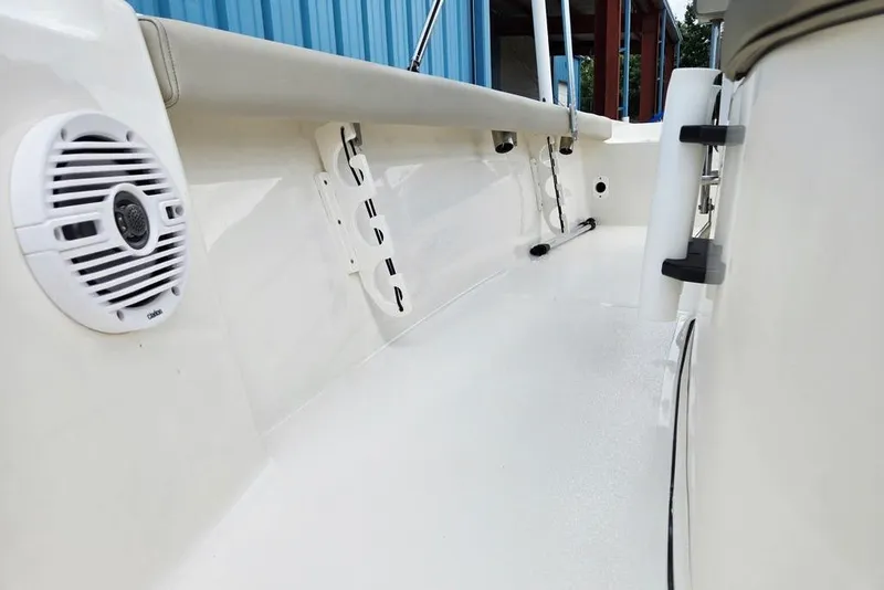 Slide: The Image of 2023 Key West 188 Bay Reef boat interior with speaker and rod holders. - 27