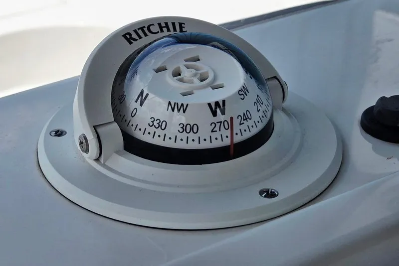 Slide: The Image of Compass on 2023 Key West 188 Bay Reef boat dashboard, showing directional headings. - 17