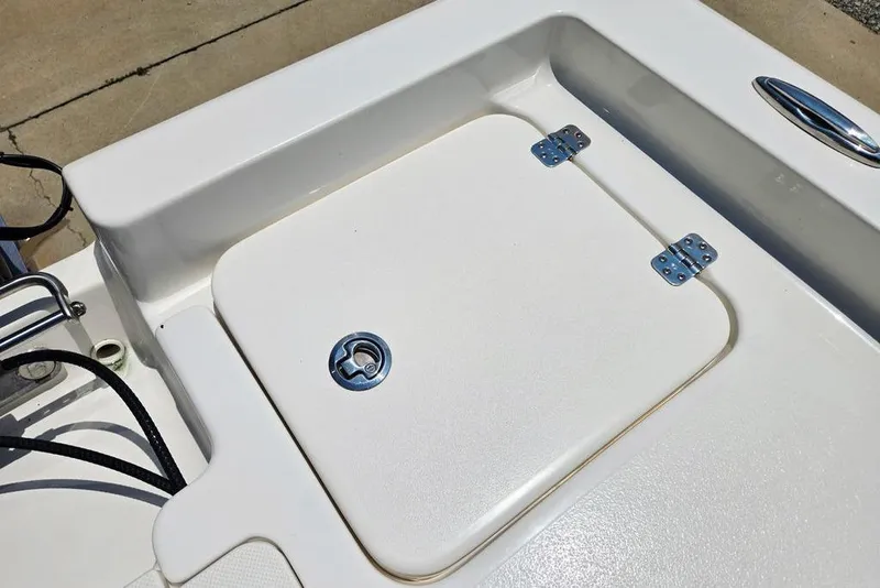 Slide: The Image of 2023 Key West 188 Bay Reef boat storage compartment with secure latch and hinges. - 43