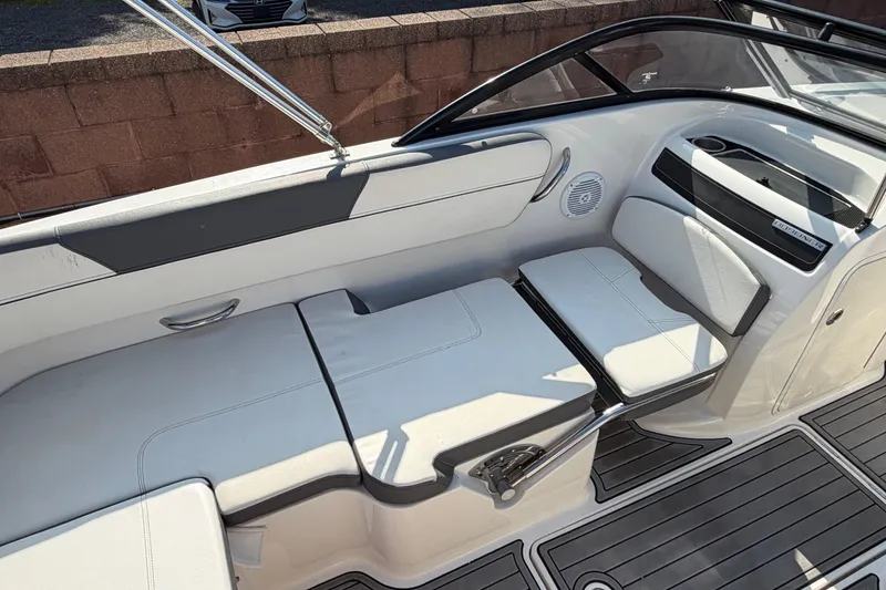 Slide: The Image of 2018 Bayliner VR5 Bowrider I/O interior seating with sleek white upholstery and modern design. - 26