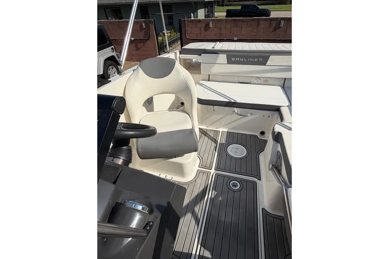 Slide: The Image of 2018 Bayliner VR5 Bowrider I/O interior with seating and steering wheel. - 31