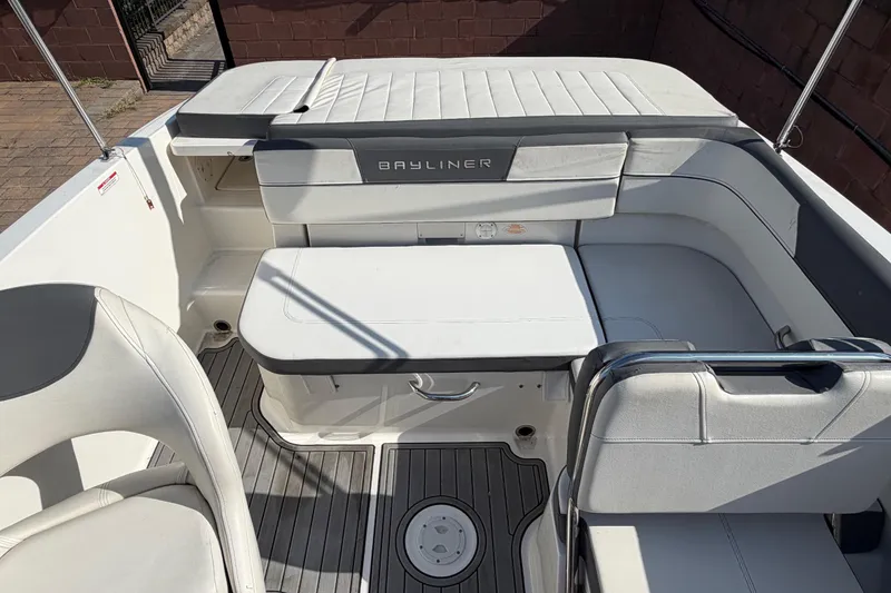 Slide: The Image of 2018 Bayliner VR5 Bowrider I/O interior with white seating and sleek design. - 13
