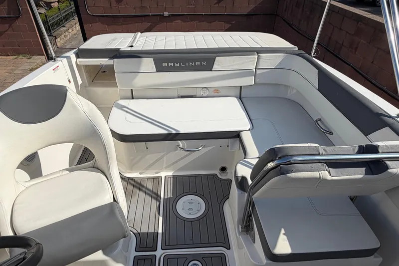 Slide: The Image of 2018 Bayliner VR5 Bowrider I/O interior with white seating and sleek design. - 25