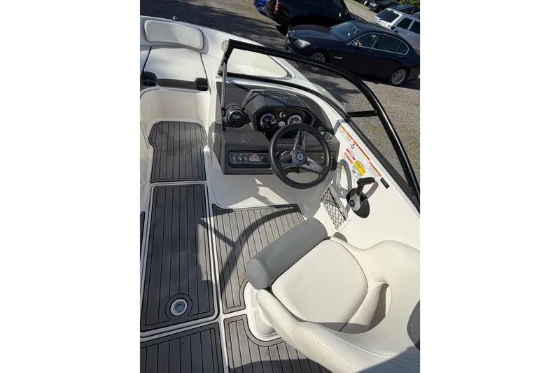 Slide: The Image of 2018 Bayliner VR5 Bowrider I/O interior with steering wheel and seating area. - 22