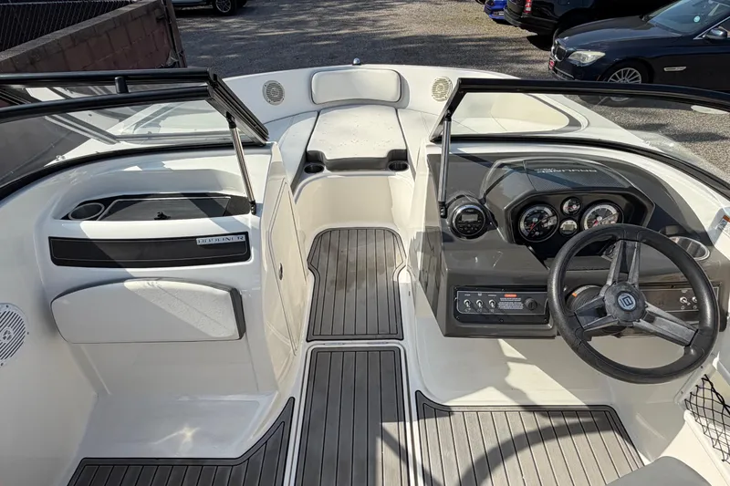 Slide: The Image of 2018 Bayliner VR5 Bowrider I/O interior with steering wheel and dashboard controls. - 28