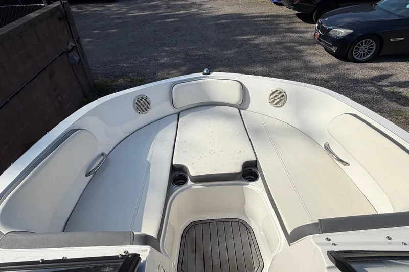 Slide: The Image of 2018 Bayliner VR5 Bowrider I/O boat interior with seating and cup holders. - 32