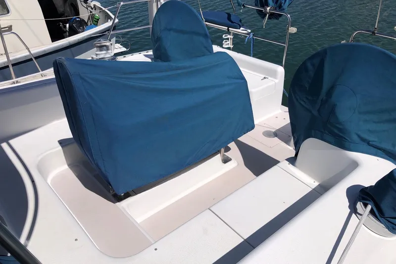 Slide: The Image of Covered seating area on a 1999 Catalina 400 sailboat deck. - 19
