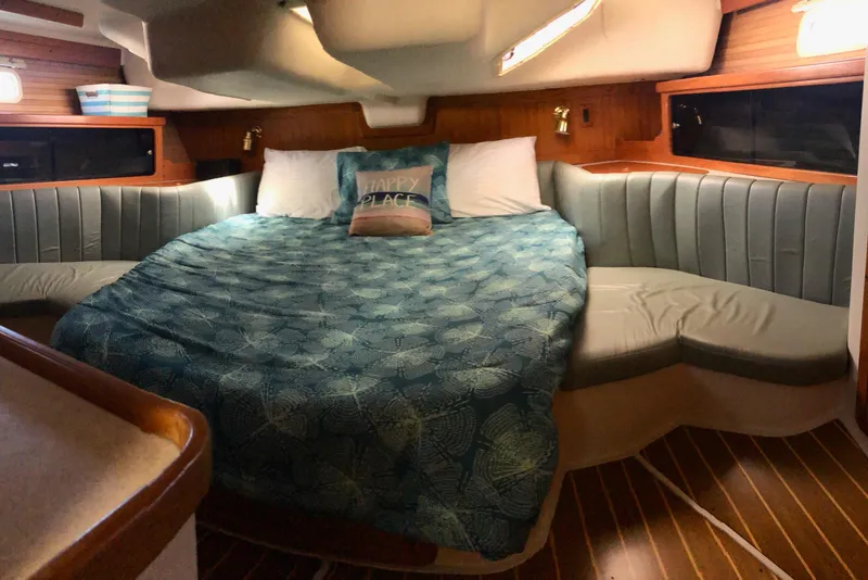 Slide: The Image of Cozy cabin interior of a 1999 Catalina 400 sailboat with a comfortable bed. - 9