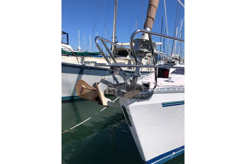 Slide: The Image of Catalina 400 sailboat from 1999 docked, featuring anchor and bow details. - 13