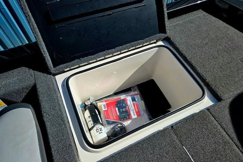 Slide: The Image of Storage compartment in a 2022 Vexus AVX1980 boat, containing various items. - 42