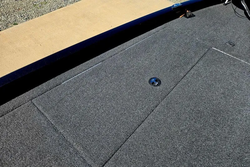 Slide: The Image of 2022 Vexus AVX1980 boat deck with gray carpet and storage compartment. - 17