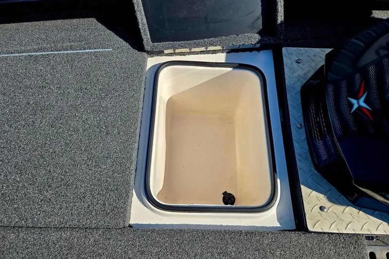 Slide: The Image of Storage compartment on 2022 Vexus AVX1980 boat, featuring carpeted flooring and seating. - 20