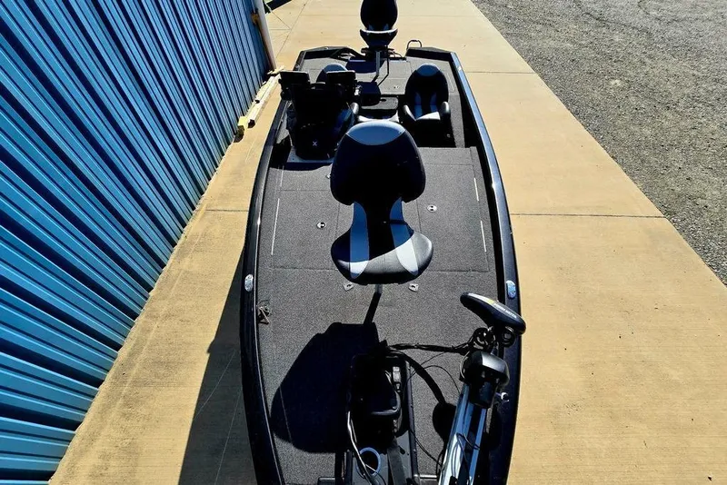Slide: The Image of 2022 Vexus AVX1980 boat parked beside a blue metal wall. - 9