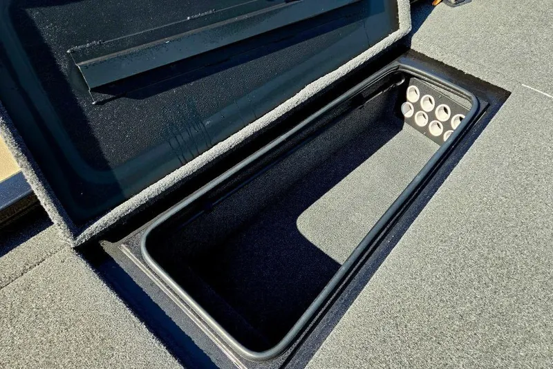 Slide: The Image of Open storage compartment in 2022 Vexus AVX1980 boat, featuring cup holders. - 18